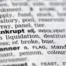 Dictionary page showing the word ‘bankrupt,’ symbolizing how filing bankruptcy can stop a lawsuit in Arizona.
