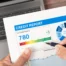 Credit report being reviewed with a pen, representing the impact of Chapter 7 bankruptcy and how long it remains on a credit report.