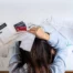 Person reviewing unpaid bills and debt collection notices